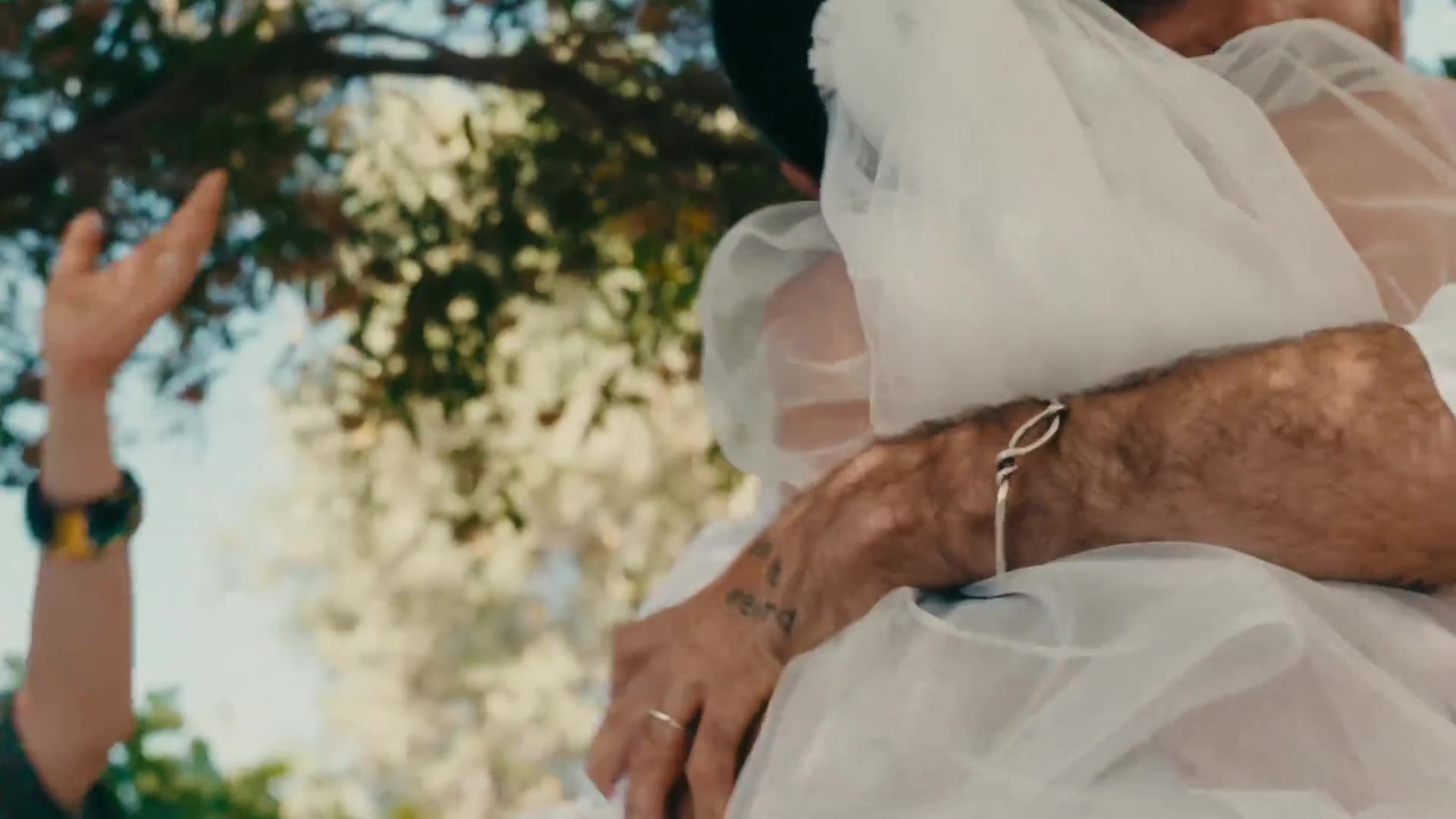 Netta and Stav embracing on their wedding day